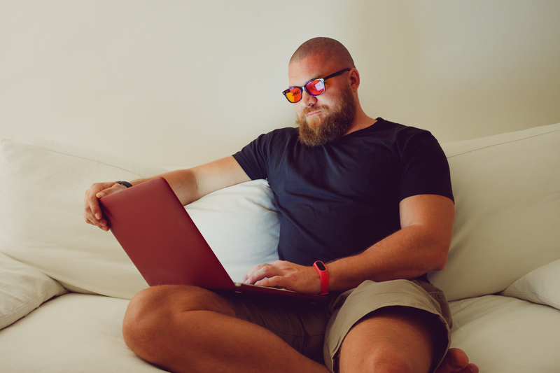 Man Wearing Blue Light Blocking Glasses