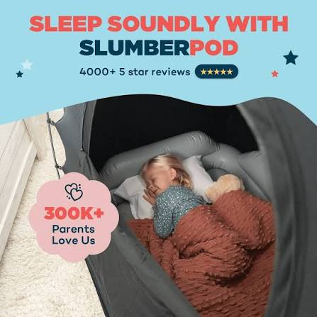 Sleeping toddler resting inside a SlumberPod portable blackout sleep tent